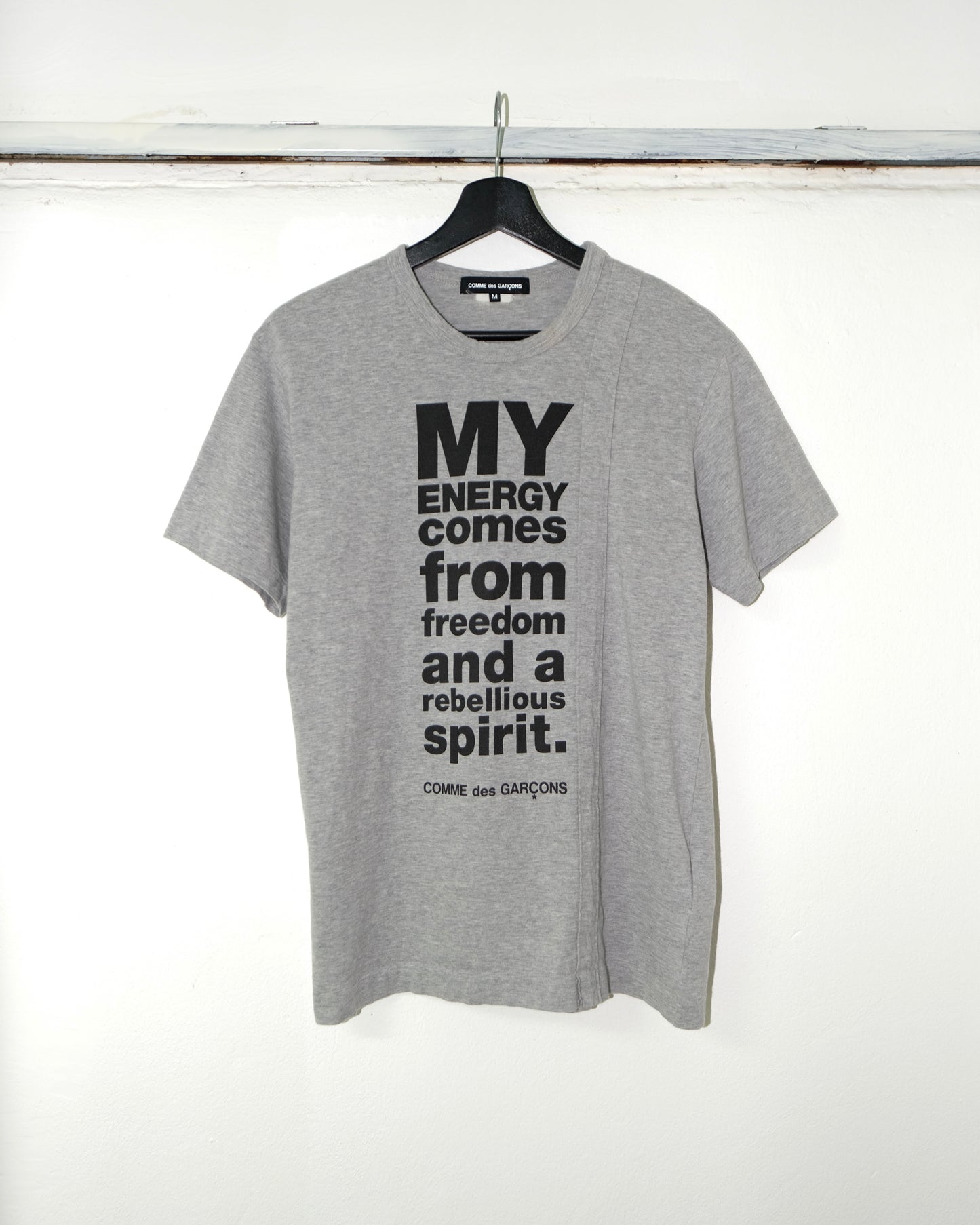 Comme Des Garcons Homme Plus
"MY ENERGY COMES FROM FREEDOM" Tee