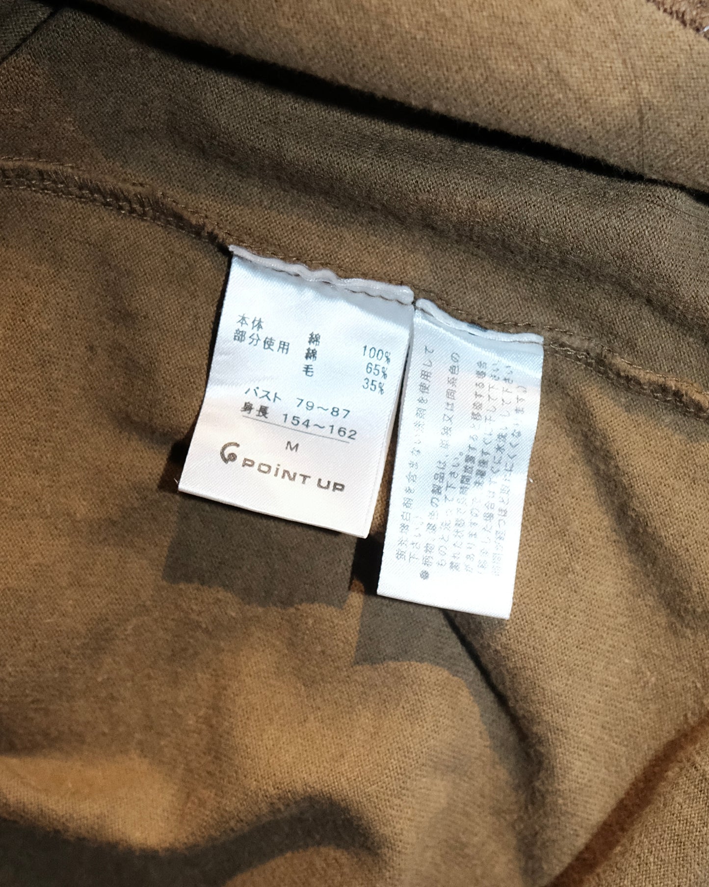 HAI SPORTING GEAR BY ISSEY MIYAKE OLIVE JUMPER WITH A PLAID PATCHWORK PANEL