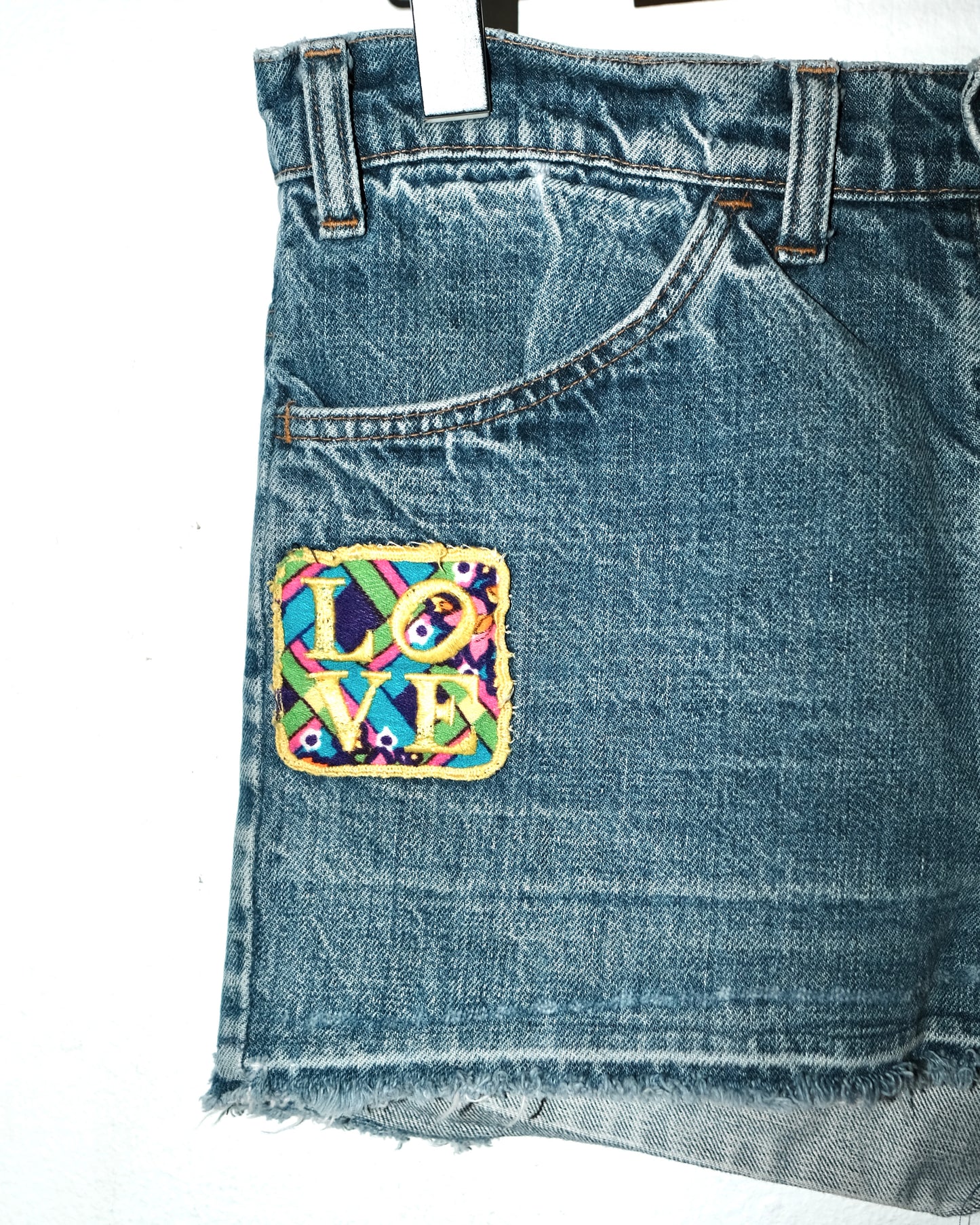 70s LEVI’S CUT-OFF WITH LOVE PATCH JEANS