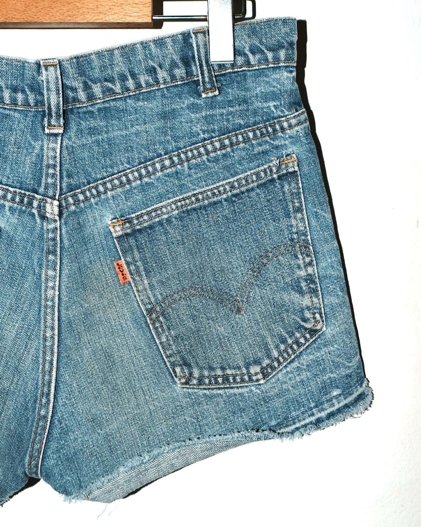 70s LEVI’S CUT-OFF WITH LOVE PATCH JEANS